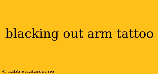 blacking out arm tattoo